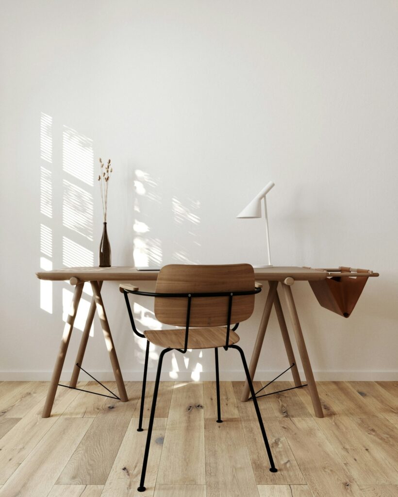 Solid wood desk in a bright room with oak planks, inspiration for custom tables