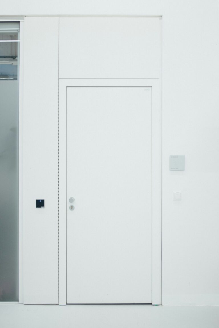 Handleless full height white door with concealed hinges, inspiration for custom doors