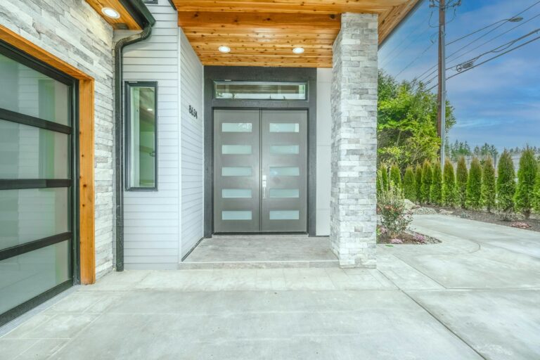 Modern double front door with glass in a new house, inspiration for custom doors