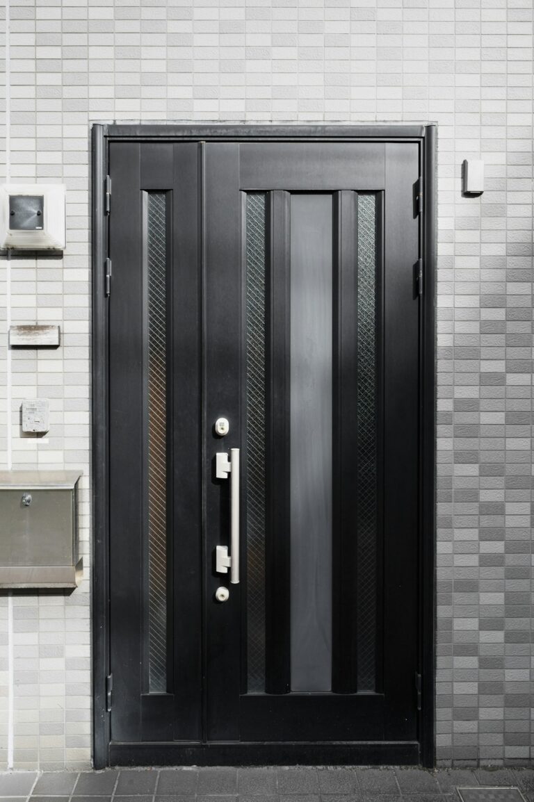 Modern black front door with narrow glass panels, inspiration for custom doors