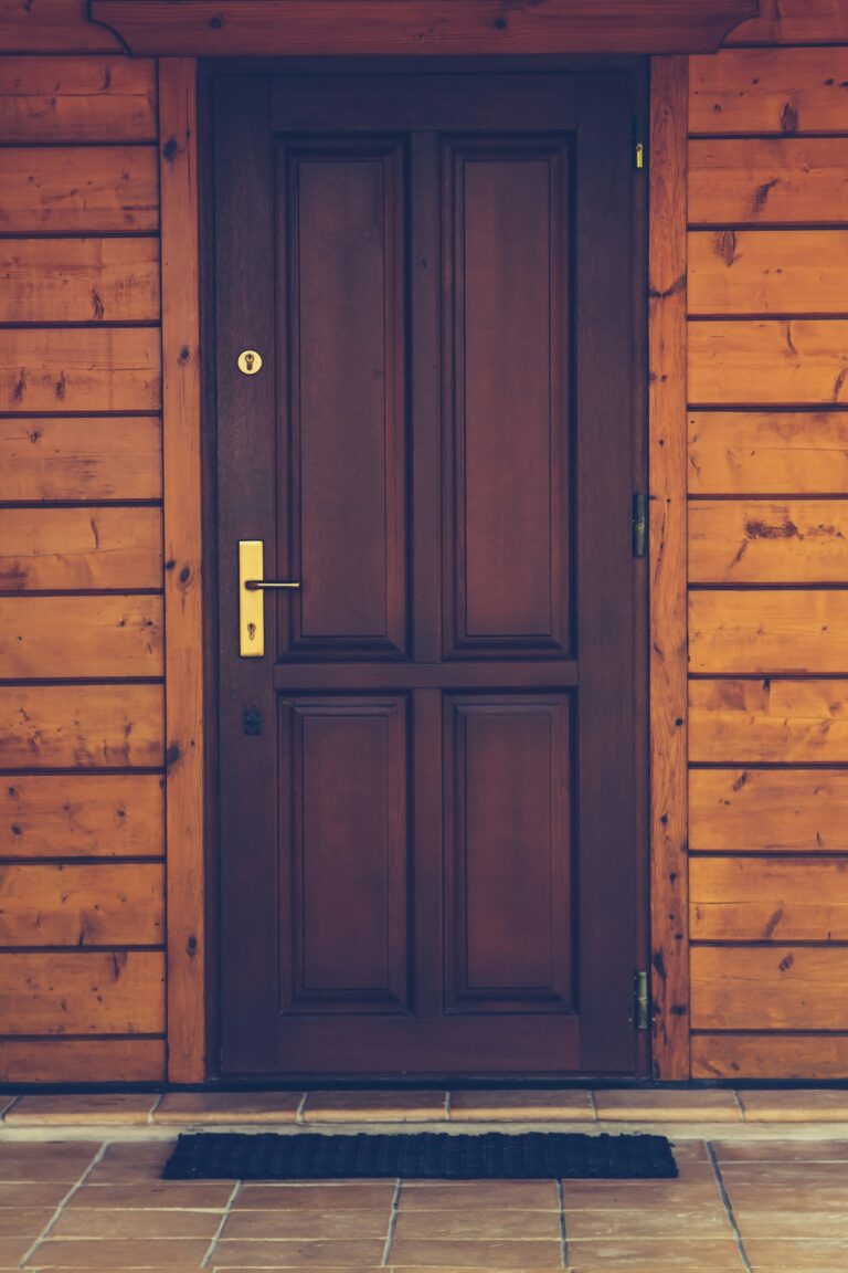 Dark solid wood door with four panels, inspiration for custom doors