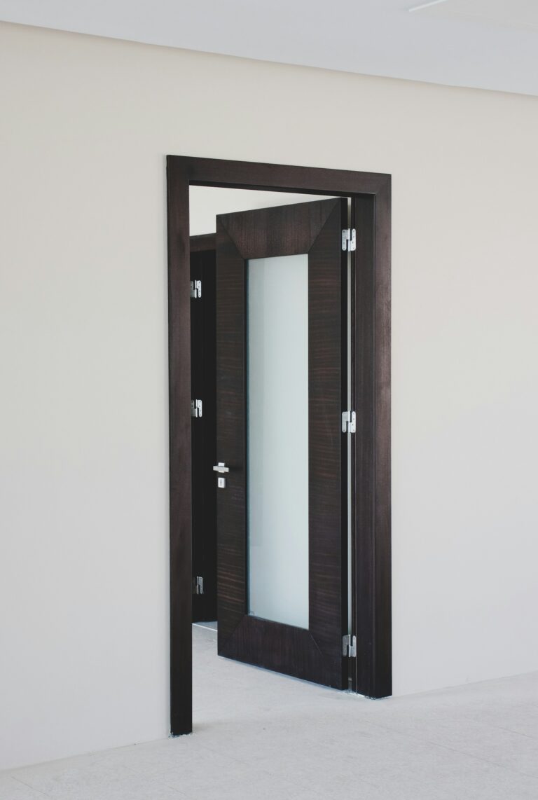 Dark wooden door with frosted glass and black frame, inspiration for custom doors