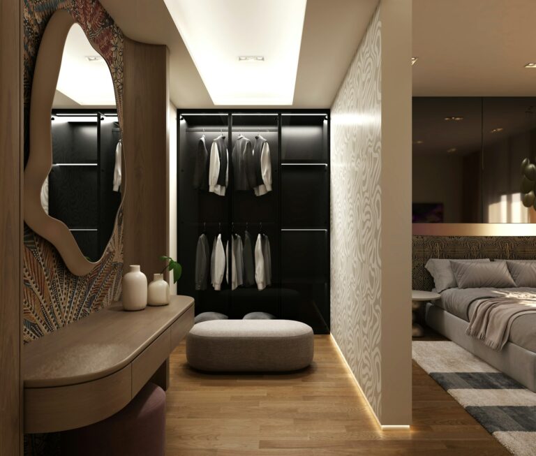 Dressing room with mirror, pouffe and lit wardrobe, inspiration for custom wardrobes