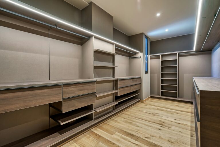 Large walk in wardrobe with LED lighting and drawer unit, inspiration for custom wardrobes