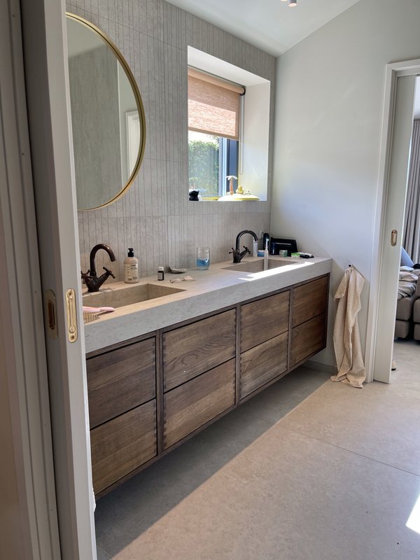 Double vanity unit in smoked oak with natural stone top
