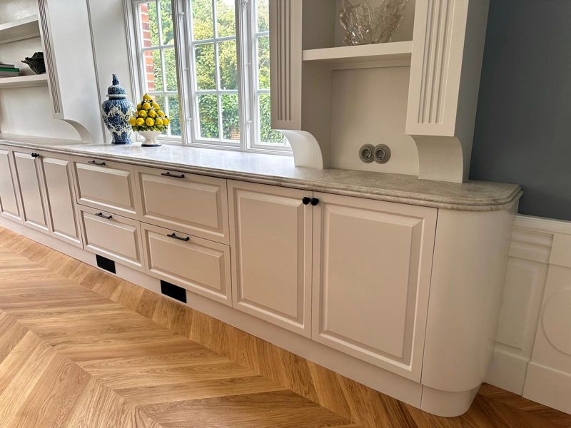 White kitchen cabinets with drawers and profiled fronts