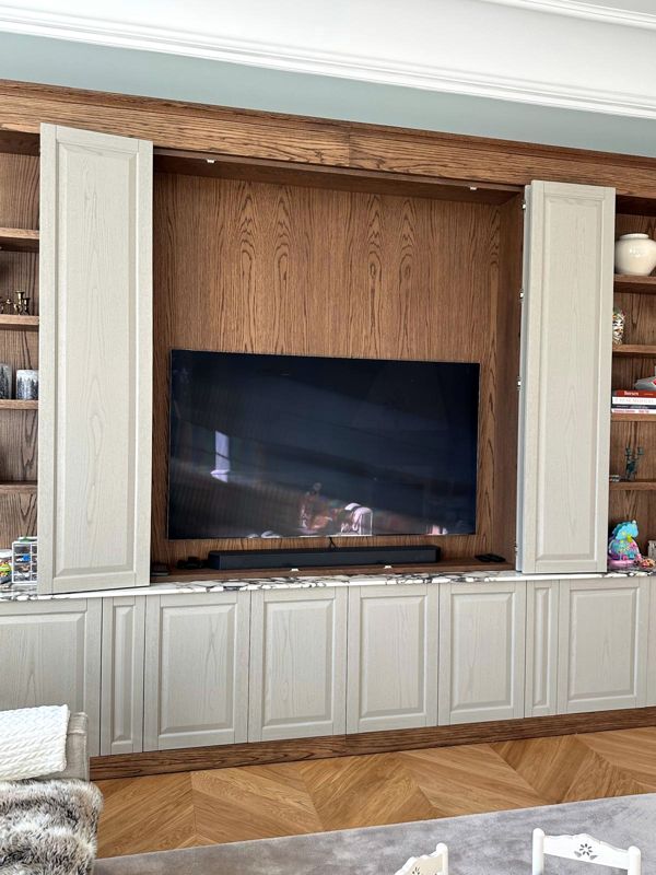 TV cabinet with folding doors that conceal the screen